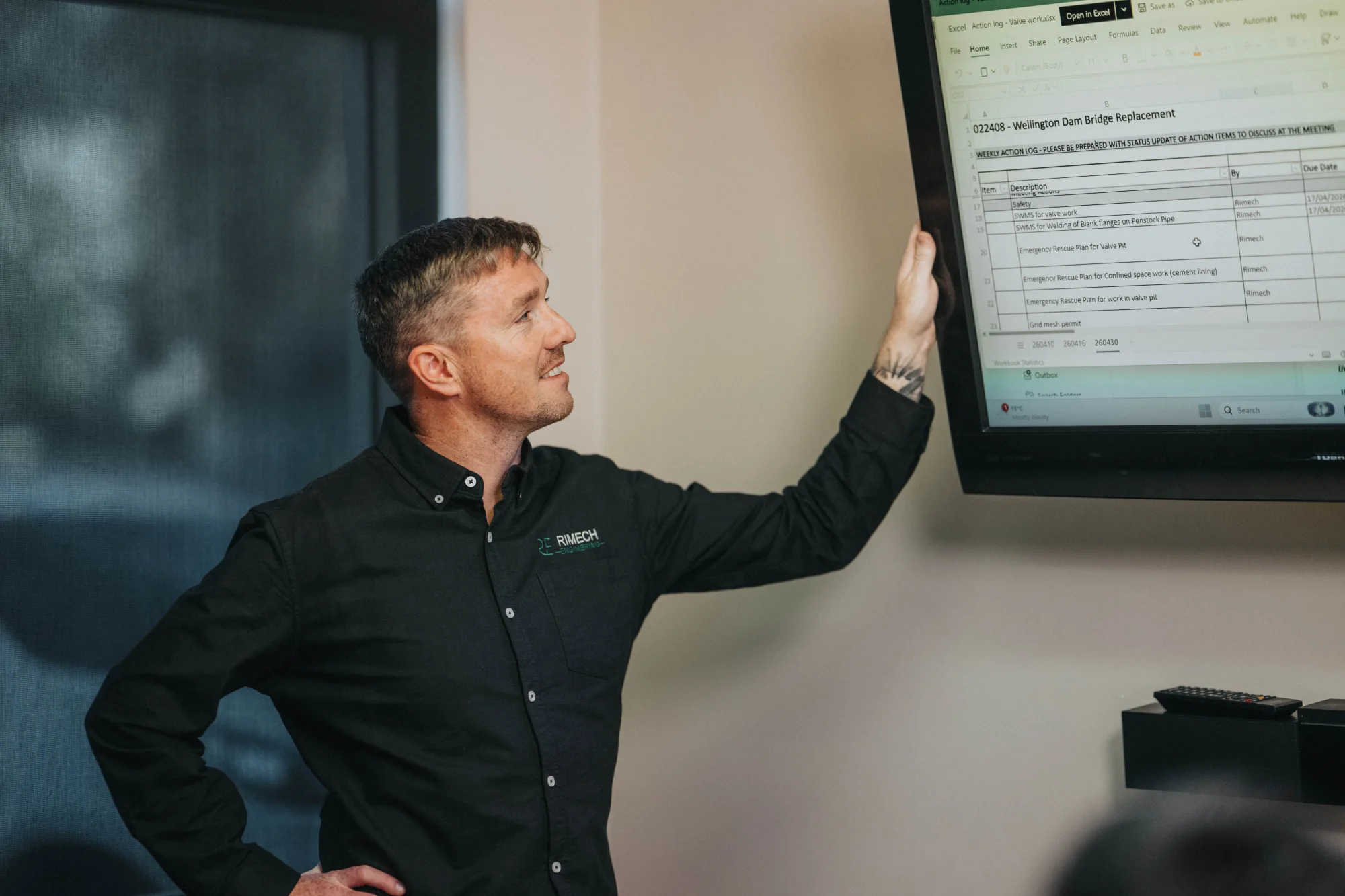 A Rimech team member reviewing project information.