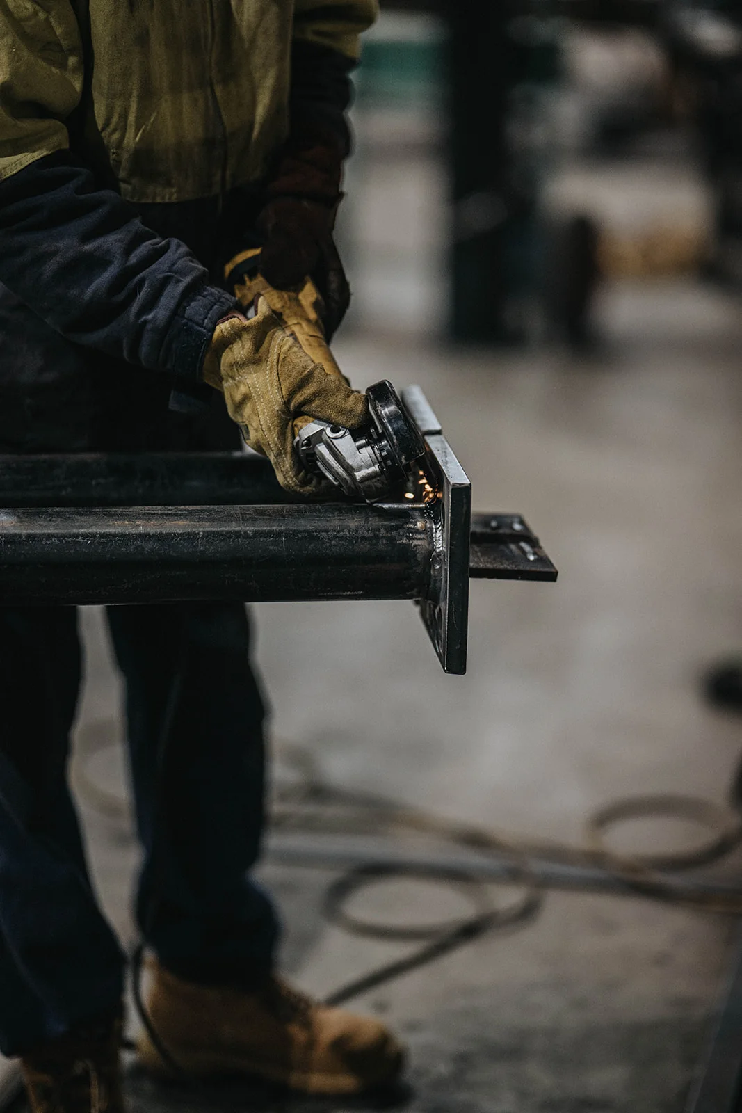 Rimech personnel working together in the fabrication workshop.